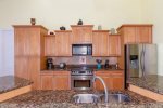 The kitchen features stainless steel appliances